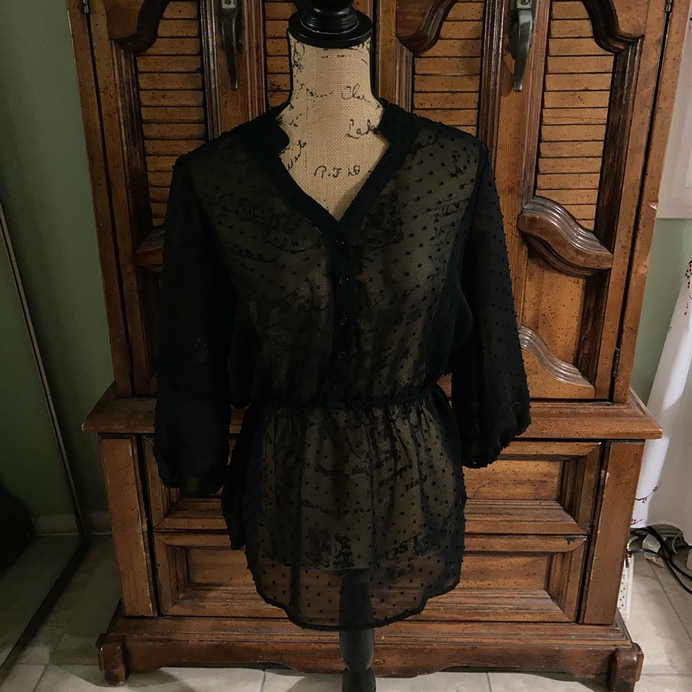 Woman’s black top with cute dots throughout. SizeM